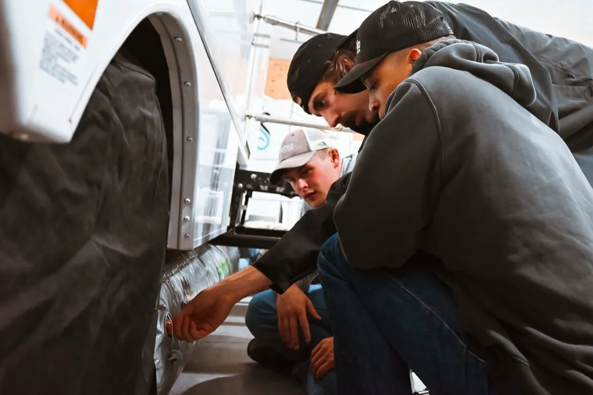 Team inspecting equipment